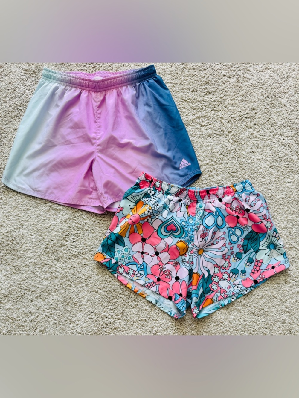 Two pairs of girl’s XL Adidas lined athletic shorts.